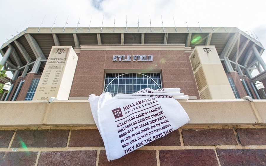 outside of Kyle Field with a hullabloo printed towel