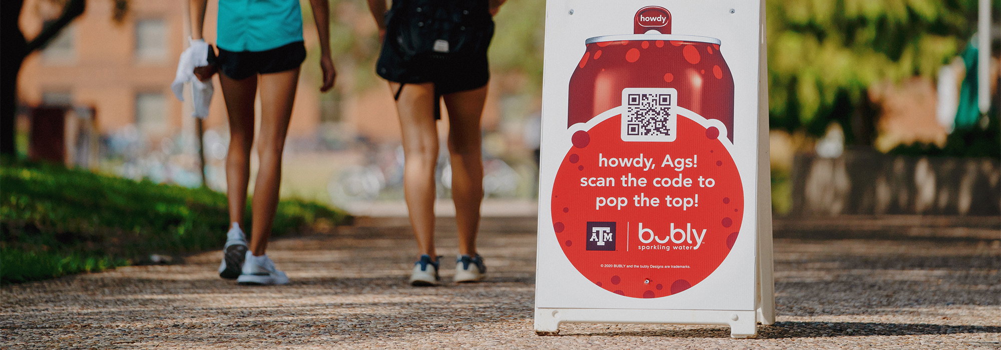 sandwich board on campus promoting Bubly Howdy Tab Vr experience 