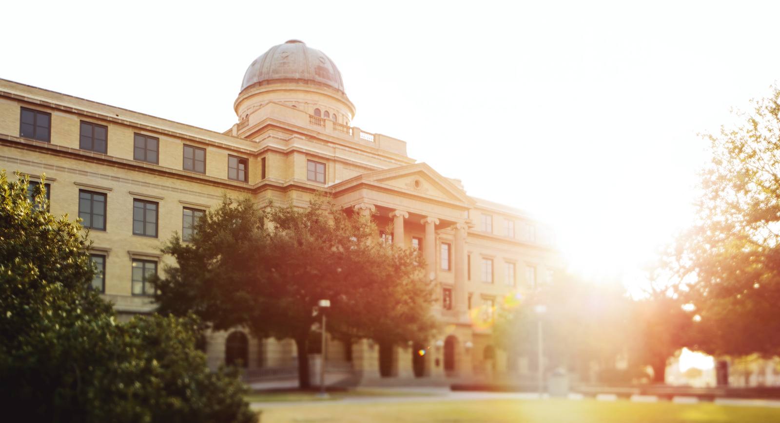 the Academic building at sunset