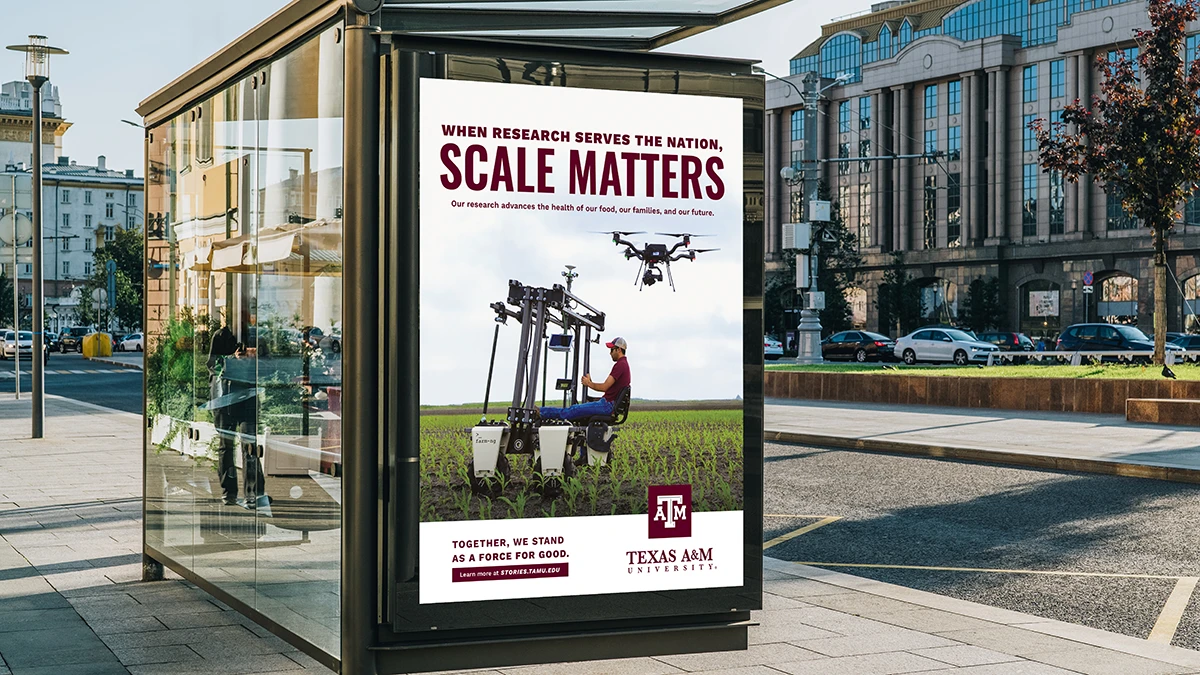 A Texas A&M bus ad showcasing a farmer using a drone and other advanced farming equipment with the headline "When research serves the nation, scale matters."
