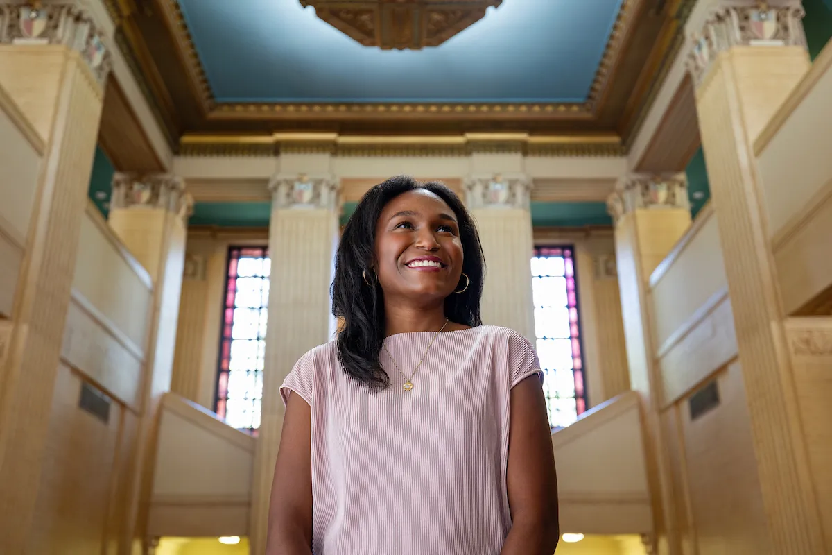 Portrait of an Aggie student looking away from camera in the JKW Administration lobby